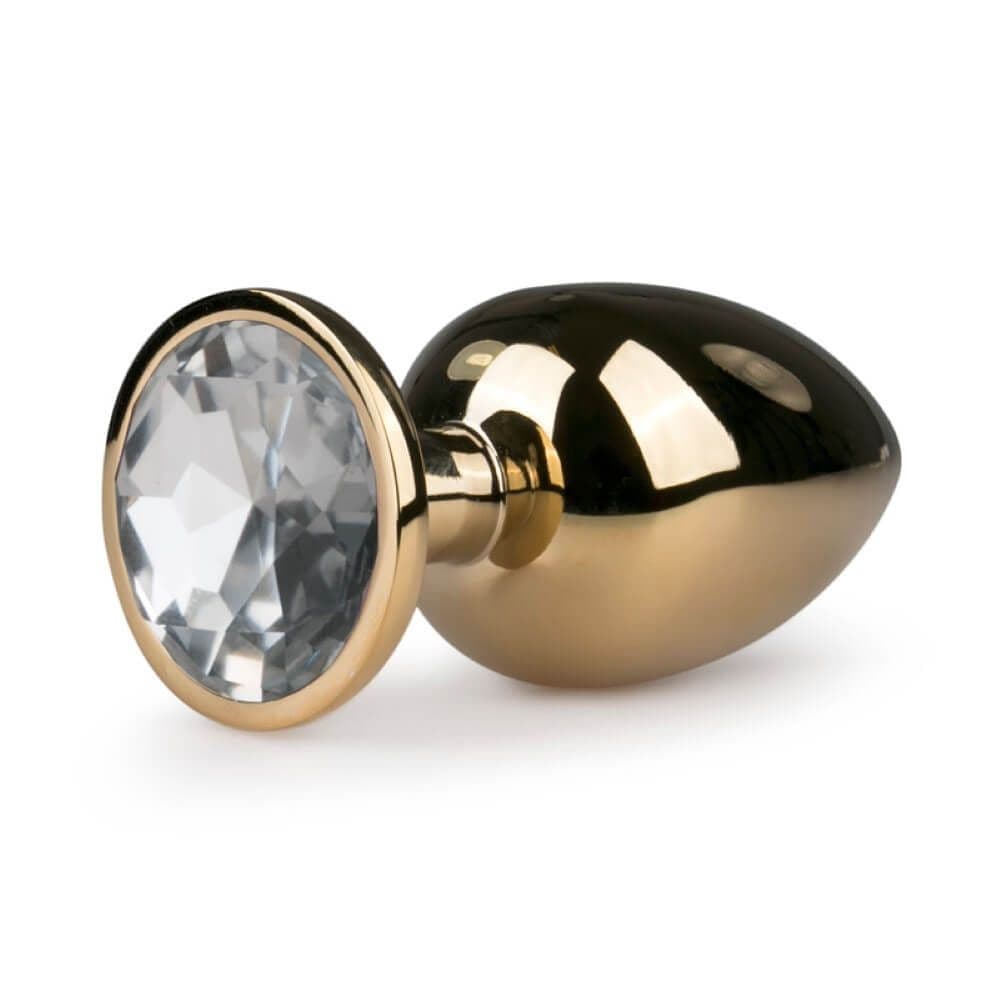 Butt plug i â€guldâ€ med smykkesten